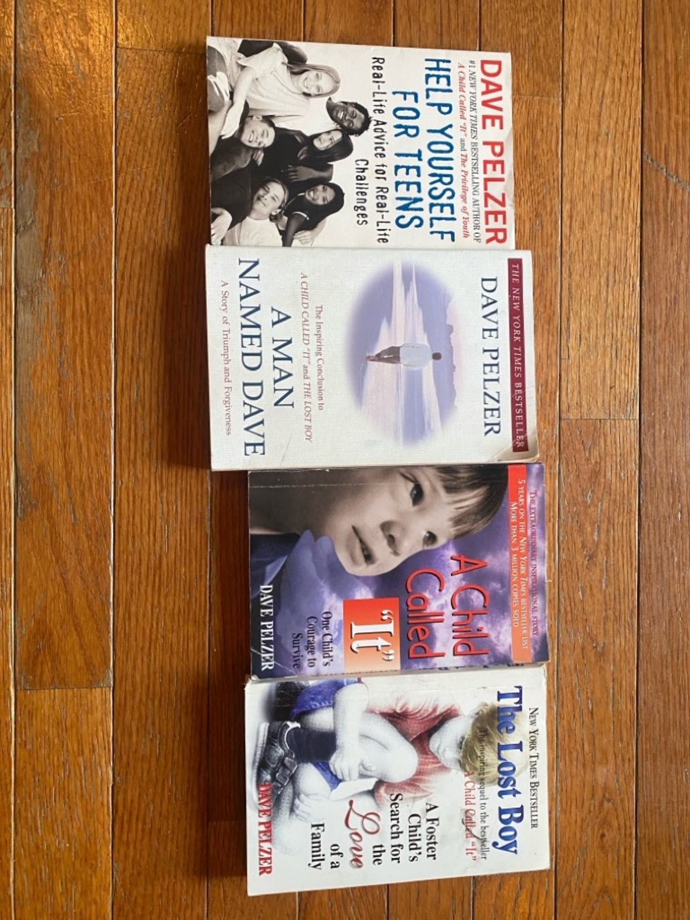 Set of 4 Dave Pelzer Paperback Books - White, Blue, Red, Purple Covers